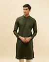 alt message - Manyavar Men Dark Green Self Patterned Kurta Set image number 0